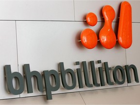 This file photo taken on February 25, 2005 shows the BHP Billiton logo at the company's Melbourne headquarters.   The world's biggest miner BHP Friday, July 26, 2018, announced the sale of its US oil and gas assets to BP for US$10.5 billion, with the funds being returned to shareholders.