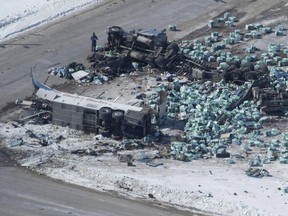 The wreckage of a fatal crash outside of Tisdale, Sask., is seen on April, 7, 2018. Members from Canada's Prairie provinces will meet next week to discuss what standardized trucking regulations would look like. Saskatchewan Premier Scott Moe says that discussions were underway prior to the Humboldt Broncos bus crash on April 6 that killed 16 people and injured 13 others.