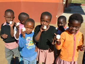 Children in eSwatini, a monarchy in southern Africa, receive eggs from Project Canaan, a project that tackle many societal issues in Africa including hunger. The project includes an egg-producing centre supported by Saskatchewan Egg Producers. Photo courtesy of Cam Broten