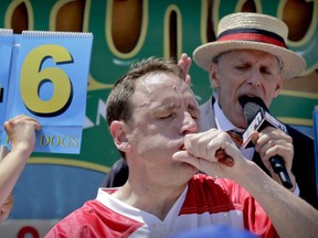 Joey Chestnut eats two hot dogs at a time during the Nathan's Annual Famous International Hot Dog Eating Contest, Tuesday July 4, 2017, in New York. Chestnut won, marking his 10th victory in the event.