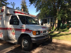 The Saskatoon Police Service and Saskatoon Fire and Protective Services are stationed outside 229 Ave F North on Fri. July 6, roughly five hours after emergency services were called in to battle a blaze in the rear of the house around 2:30 a.m. During the response, firefighters searched the home and found the body of an adult. (Andrea Hill / Saskatoon StarPhoenix)