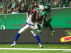 The Saskatchewan Roughriders' Naaman Roosevelt makes a spectacular touchdown catch over the Montreal Alouettes' Dominique Ellis on Saturday.