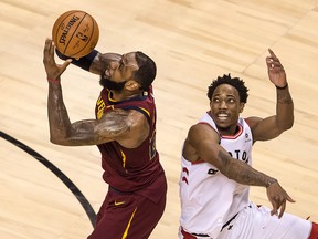 In this May 1 file photo, Toronto Raptors guard DeMar DeRozan (right) attempts to block Cleveland Cavaliers forward LeBron James' shot in Game 1 of their second-round playoff series.