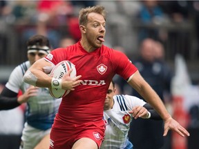 Canada's Harry Jones runs the ball against France during World Rugby Sevens Series action, in Vancouver, B.C., on Sunday March 11, 2018.