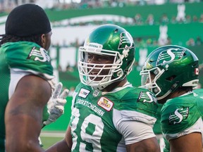 The Saskatchewan Roughriders' Charleston Hughes celebrates after returning a fumble 57 yards for a touchdown Thursday against the visiting Hamilton Tiger-Cats.