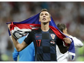 Croatia's Mario Mandzukic celebrates after his team advanced to the final during the semifinal match between Croatia and England at the 2018 soccer World Cup in the Luzhniki Stadium in Moscow, Russia, Wednesday, July 11, 2018.