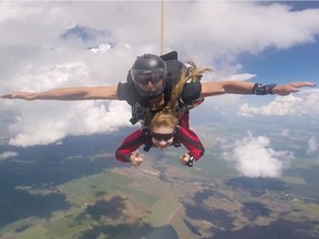 Leader-Post intern reporter Lynn Giesbrecht, bottom, freefalls from a plane in a tandem jump with Captain John Hart of the Canadian Armed Forces SkyHawks skydiving team over the Moose Jaw municipal airport. Photo courtesy of SkyHawks