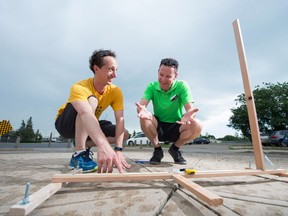 Kurtis Baute, left, a former science teacher in Vancouver and now a full time YouTuber, shows his sundial to Casey Sakires, manager of programming at the Saskatchewan Science Centre, on Harvey Street.
