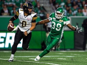 The Saskatchewan Roughriders' Charleston Hughes, 39, pressures Hamilton Tiger-Cats quarterback Jeremiah Masoli on July 5 at Mosaic Stadium.