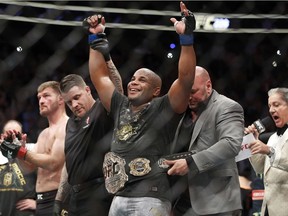 Daniel Cormier celebrates after defeating Stipe Miocic in a heavyweight title mixed martial arts bout at UFC 226, Saturday, July 7, 2018, in Las Vegas.