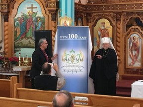National Jubilee Committee-Ukrainian Orthodox Church of Canada Chair Gene Zwozdesky, left, and His Eminence Metropolitan Yurij unveil a poster at a news conference at Holy Trinity Ukrainian Orthodox Cathedral in Saskatoon announcing the official launch of the 100th anniversary -- the "Cenetary" -- of the Ukrainian Orthodox Church of Canada which started 100 years ago in Saskatoon. Jeff Losie/Saskatoon StarPhoenix