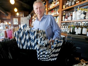In this June 19, 2018 photo, paper straws sit at Duke Moscrip, owner of Duke's Restaurants, bar at his restaurant in Seattle. Businesses that sell food or drinks won't be allowed to offer the plastic items under a rule that went into effect Sunday, July 1.
