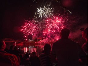 A large crowd watches the fireworks display on River Landing during the Fireworks Festival in Saskatoon