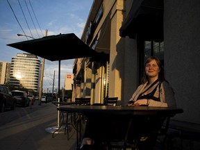 Lara Whelens sits outside a Starbucks during a warm summer night in Saskatoon, SK on Saturday, June 23, 2018.