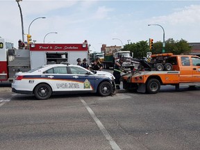 Saskatoon Police Service members on scene at a crash involving a Saskatoon police cruiser at the intersection of Idylwyld Drive and 22nd Street West on Aug. 1, 2018. (Matthew Olson/The Saskatoon StarPhoenix)