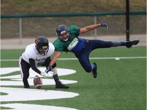 Jay Assoon (right) makes a leaping defensive play against receiver Matthew Proulx (left) at the 6 Nations Elite Development Camp in Saskatoon on August 4, 2018.