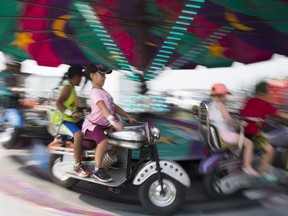 Myah Steinhauer sits on a ride during last year's Saskatoon Exhibition at Prairieland Park.