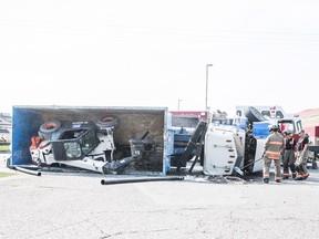 The Saskatoon Fire Department respond to a semi truck rollover on Miller Avenue and 43rd street in Saskatoon, SK on Tuesday, August 7, 2018.