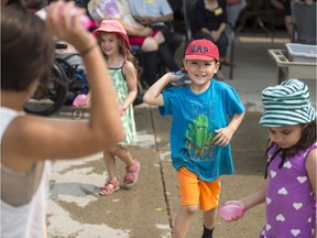 Children from Oak Tree and Acorn Day Care during a water balloon fight at Sherbrooke Community Centre in Saskatoon on Aug. 9, 2018.