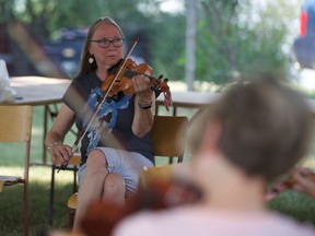 Fiddle instructor Fay MacKenzie teaches a class of beginners at the John Arcand Fiddle Festival just south of Saskatoon on August 10, 2018.