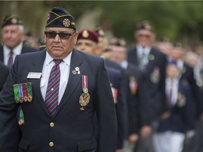 Dominion vice-president Jerome Burke marches during a parade downtown held by the Army, Navy and Air Force Veterans in Canada Association in Saskatoon on Aug. 12, 2018.