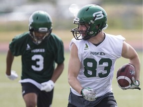 Huskies' receiver Anthony Ferwerda runs with the ball after making a catch during opening day of training camp on Tuesday.