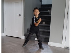 Five-year-old Leandro Godoy shows off some of his dance moves in his family's home in Saskatoon ahead of performing in Folkfest on August 17, 2018.