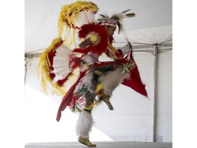 A dancer performs at the Indian & Métis pavilion at Folkfest.