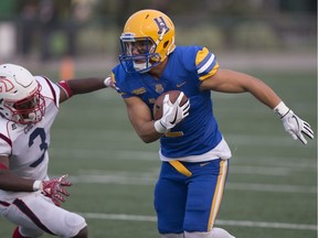 Hilltops receiver David Solie goes to run the ball during the home-opener at SMF Field in Saskatoon on Saturday, August 25, 2018.