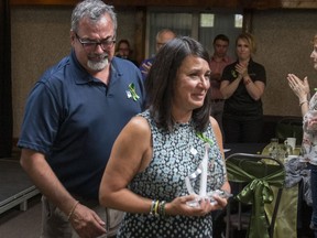 Toby Boulet, left, and Bernadine Boulet, parents of Logan Boulet, who died after the April 6 Humboldt Broncos bus crash, received the Angel's Legacy Humanitarian Award on behalf of their son in Humboldt on Thursday, August 23, 2018. The award was renamed the Logan Boulet Humanitarian Award for inspiring a movement for people in Canada and beyond to register as organ donors.