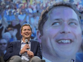 Conservative Party of Canada Leader Andrew Scheer is seen on stage while speaking to delegates at the Conservative national convention in Halifax on Saturday, Aug. 25, 2018.