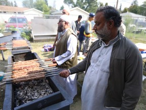 Faheem Ahmed (right) oversees the making and cooking of thousands of kebabs at the Islamic Association of Saskatchewan's Eid Street Festival on August 25, 2018.