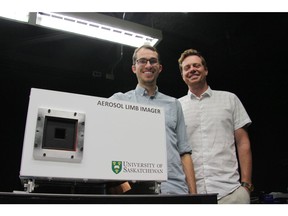 University of Saskatchewan student Matt Kozun (left) and professor Adam Bourassa with prototype device ALI. (Photo by Daniel Hallen for the University of Saskatchewan)