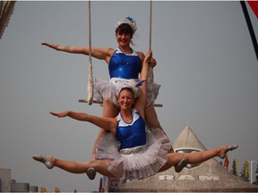 The Silver Starlets, Glory Dearling (top) and Molly Keczan, pose on the duo trapeze at the Saskatoon Ex in Saskatoon, Sask. on Thursday, August 9, 2018. The Silver Starlets perform daily at 3:30 p.m., 5 p.m., and 7:30 p.m.