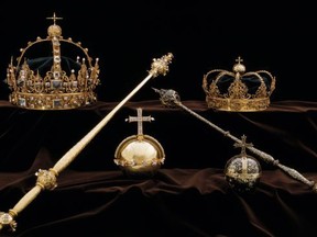 The Swedish royal funeral regalia, including gold burial crowns (dated from the 17th century) belonging to King Karl IX (top-L) and his wife Queen Christina (top-R) on display at the Strängnäs Cathedral, located 100 kilometers (60 miles) west of Stockholm. (Swedish Police/HO/Getty Images)