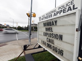 A police sign near the location of Bombay Bhel in Mississauga after a bomb was detonated. Diamond and Diamond law, have announced a $1 Million dollar lawsuit against the Bombay Bhel Tuesday August 21, 2018.