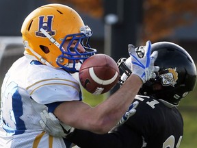 The Saskatoon Hilltops' Jason Price pulls in a pass against the Windsor AKO Fratmen during the team's Canadian Bowl win last season.