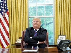 U.S. President Donald Trump speaks to reporters after a phone conversation with Mexico's President Enrique Pena Nieto on trade in the Oval Office of the White House in Washington, on Monday.