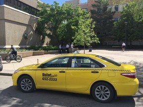 A taxi is parked on Third Avenue outside city hall on Tuesday, June 19, 2018, while Saskatoon city council's transportation committee discusses rules to amend the taxi bylaw inside. (PHIL TANK/The StarPhoenix)