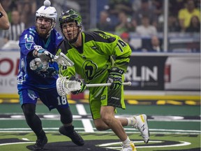 Saskatchewan Rush transition Jeremy Thompson, right, and Rochester Knighthawks defense Jake Withers battle for the ball during the third quarter of game one of the National Lacrosse League finals in Saskatoon on Saturday May 26, 2018.