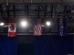 The Iroquois flag, right, hangs beside the Canadian and U.S. flags before USA vs Iroquois action at the 2018 IIJL World Junior Lacrosse Tournament in Saskatoon, Sask., Aug. 09, 2018.