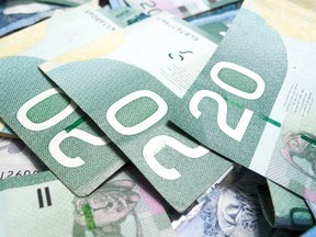 Local Input~ Full frame of twenty Canadian dollar bills, money. Credit: fotolia ORG XMIT: POS1506301144381787