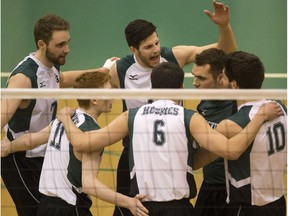 The University of Saskatchewan Huskies celebrate a point against the University of Regina Cougars in 2016.