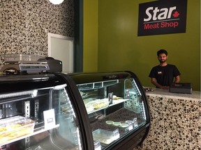 Amit Jangra, co-owner of Star Meat Shop, poses inside of his new business located in Hampton Village in Saskatoon on August 15, 2018. (Erin Petrow/ Saskatoon StarPhoenix)