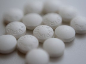 This Thursday, Aug. 23, 2018 photo shows an arrangement of aspirin pills in New York. New studies find most people won't benefit from taking daily low-dose aspirin or fish oil supplements to prevent a first heart attack or stroke.