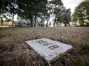 A gravestone bearing prisoner number 3568 belonging to Fernand Robert Bouchard, who died on August 25, 1967 at the age of 36, marks his gravesite at the restored B.C. Penitentiary Cemetery, in New Westminster, B.C., on Tuesday August 28, 2018. The federal prison operated in New Westminster from 1878 to 1980 and a city task force has been working to restore the site and uncover its hidden history.