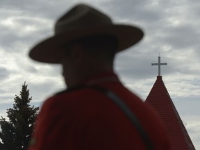 An Mountie stands during the annual RCMP National Memorial Service held at RCMP "Depot" Division in Regina, Sask. on Sunday Sept. 11, 2016.