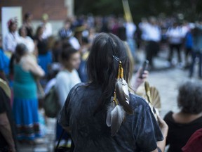Sixties Scoop survivors and supporters gather for a demonstration at a courthouse on the day of a class-action court hearing in Toronto on Tuesday, August 23, 2016.