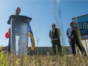 Regina mayor Michael Fougere, left, speaks at a sod-turning event for the city's new Transit Fleet Maintenance Facility on Winnipeg Street. To his right are Liberal MP Ralph Goodale and Warren Kaeding, provincial Minister of Government Relations.