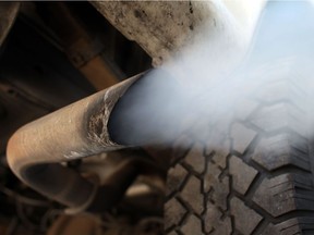 Exhaust flows out of the tailpipe of a vehicle.